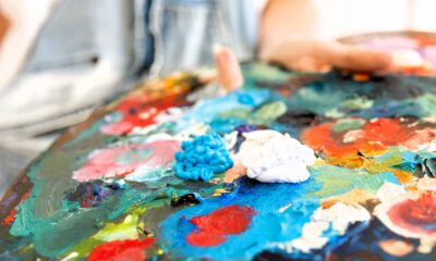 close up person holding painting palette 2638 x 1759