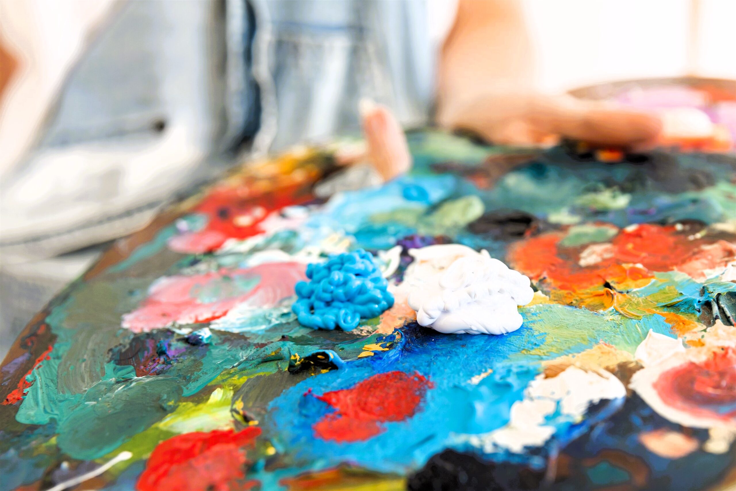 close up person holding painting palette 2638 x 1759 scaled